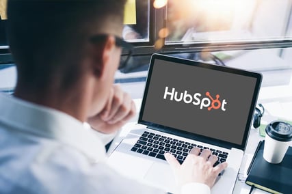 Man Looking at HubSpot on His Laptop