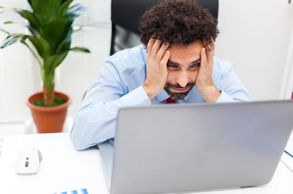 Man-feeling-frustrated-at-computer-1424x949